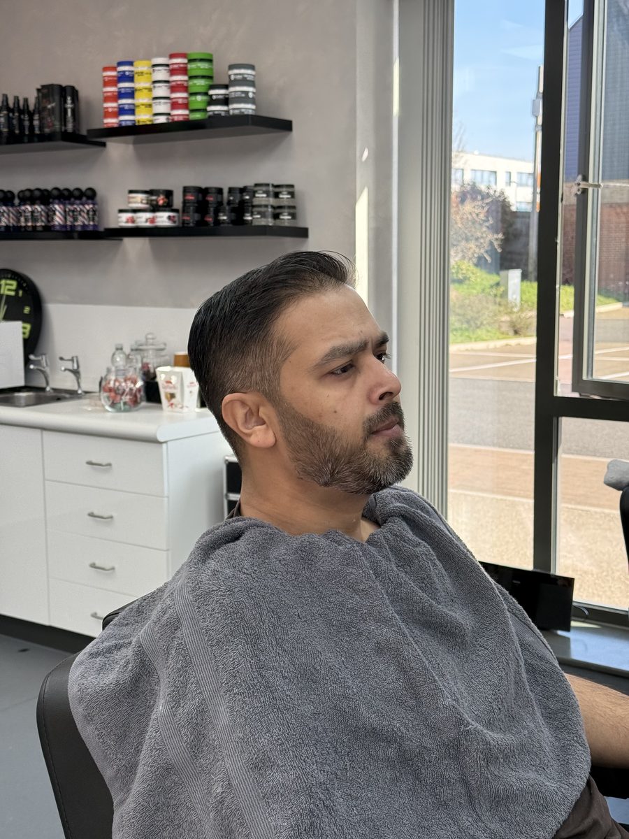 After — clean side parting, fade and tidy beard