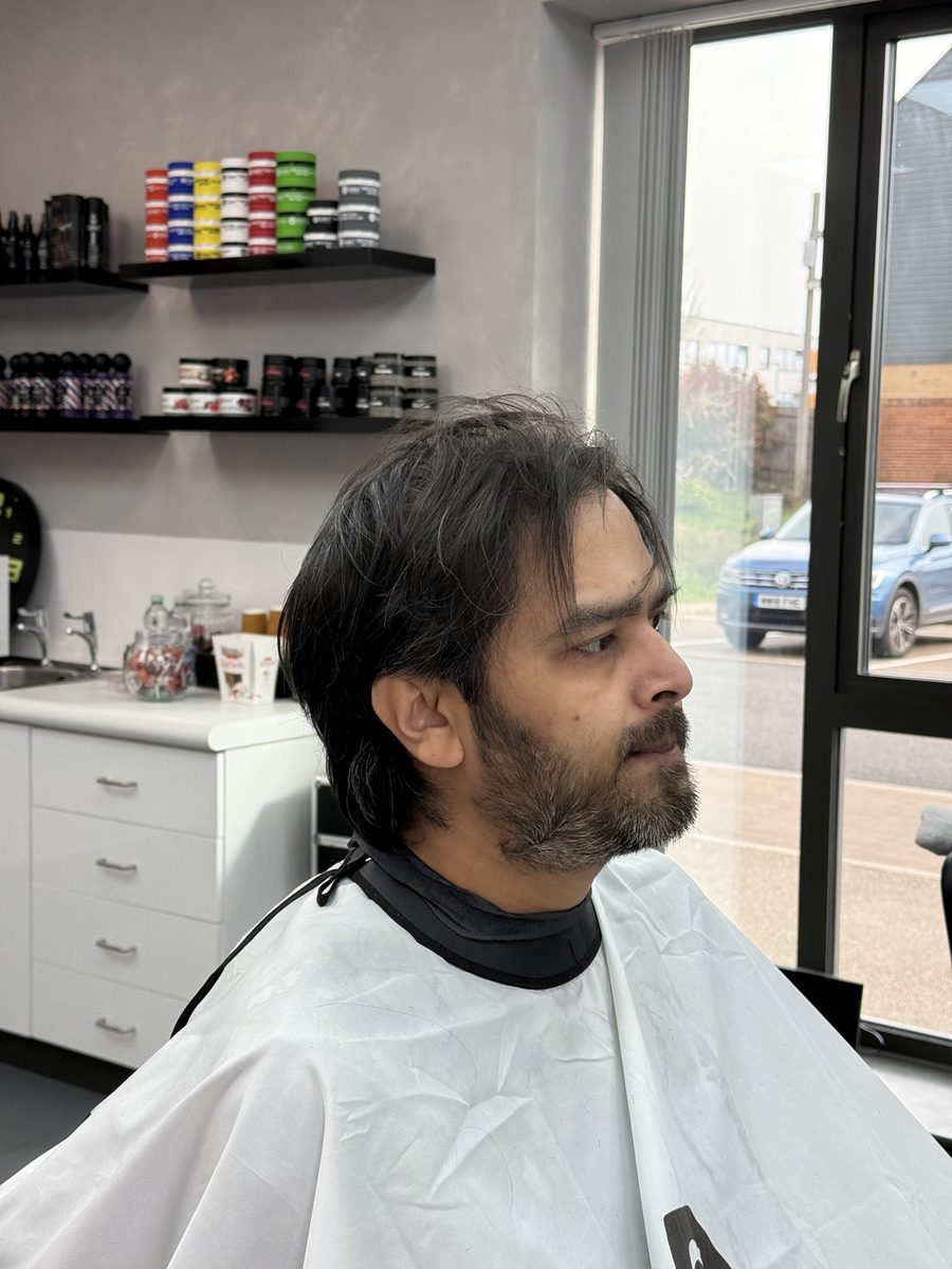 Before — long hair and untrimmed beard