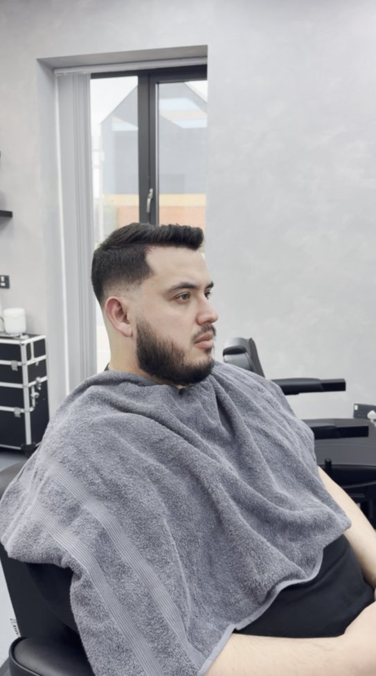 After — sharp side parting fade with tidy beard