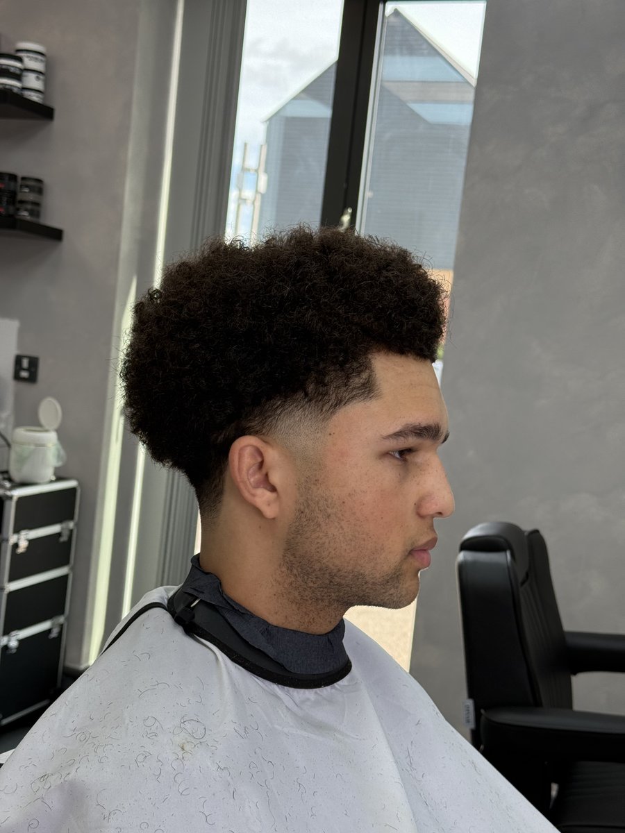 After — defined curls with skin fade